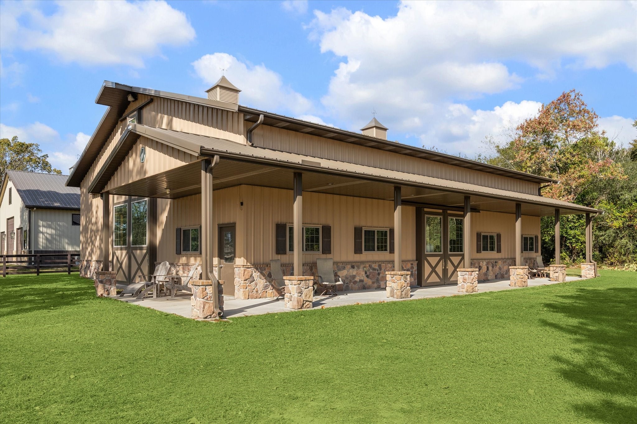 11 Willowcreek Ranch Road Tomball, TX 77377 - Photo 8 of 49 The Morton custom built barn measures 60x58 including the covered porch area. It boasts double sliding barn doors, passenger doors, operational windows, as well as a oversized garage door at the rear. The barn is equipped with 30amp, 40amp and 50amp electric. It easily houses a full size RV. The path from the motor court to the barn has been reinforced with crushed concrete and crushed granite to support over 45k lbs with no issue! The barn may be equipped with a loft or adapted for horses if desired.