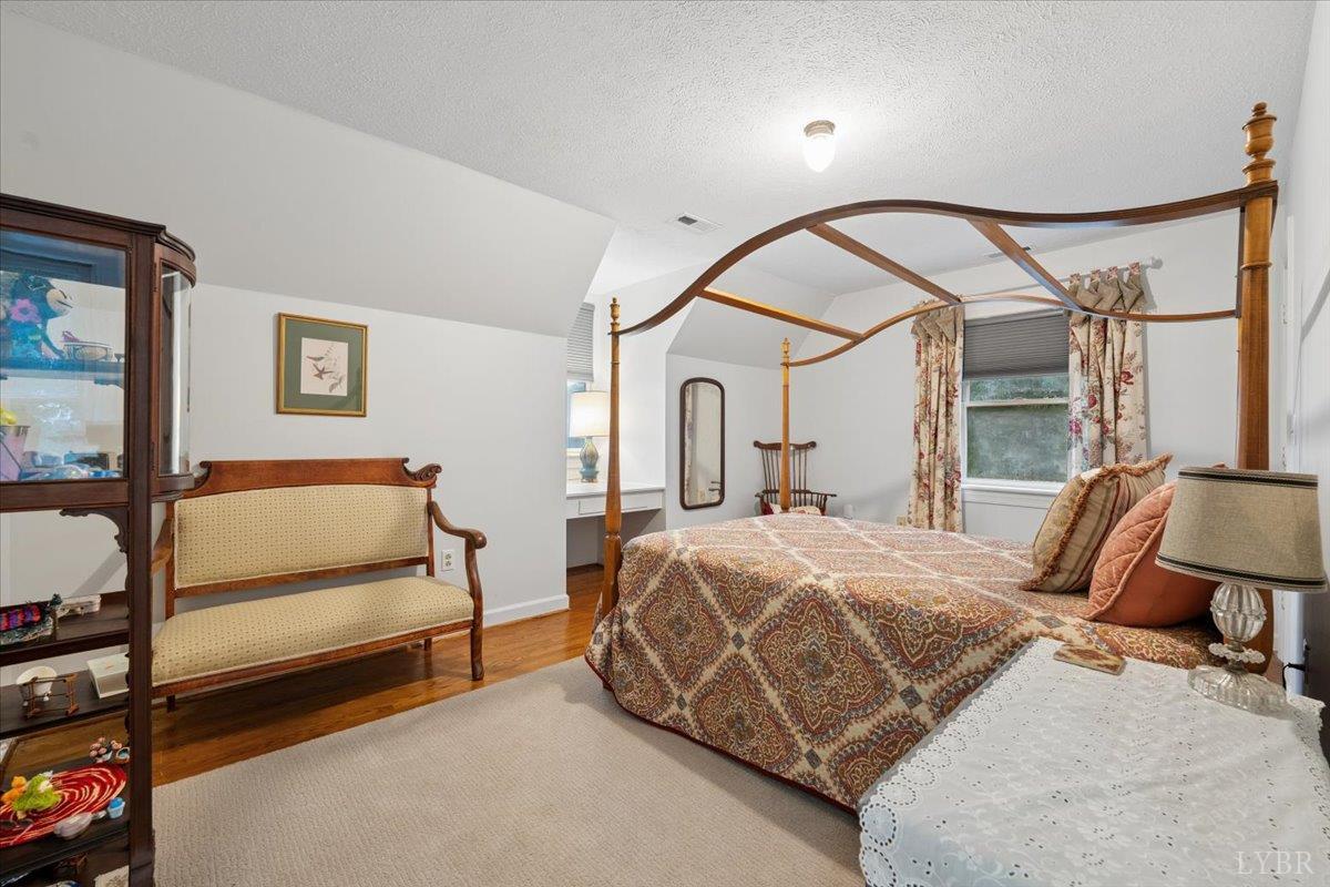 3289 Peaks Road Bedford, VA 24523 - Photo 59 of 71 a bedroom with a bed next to a window with outer view