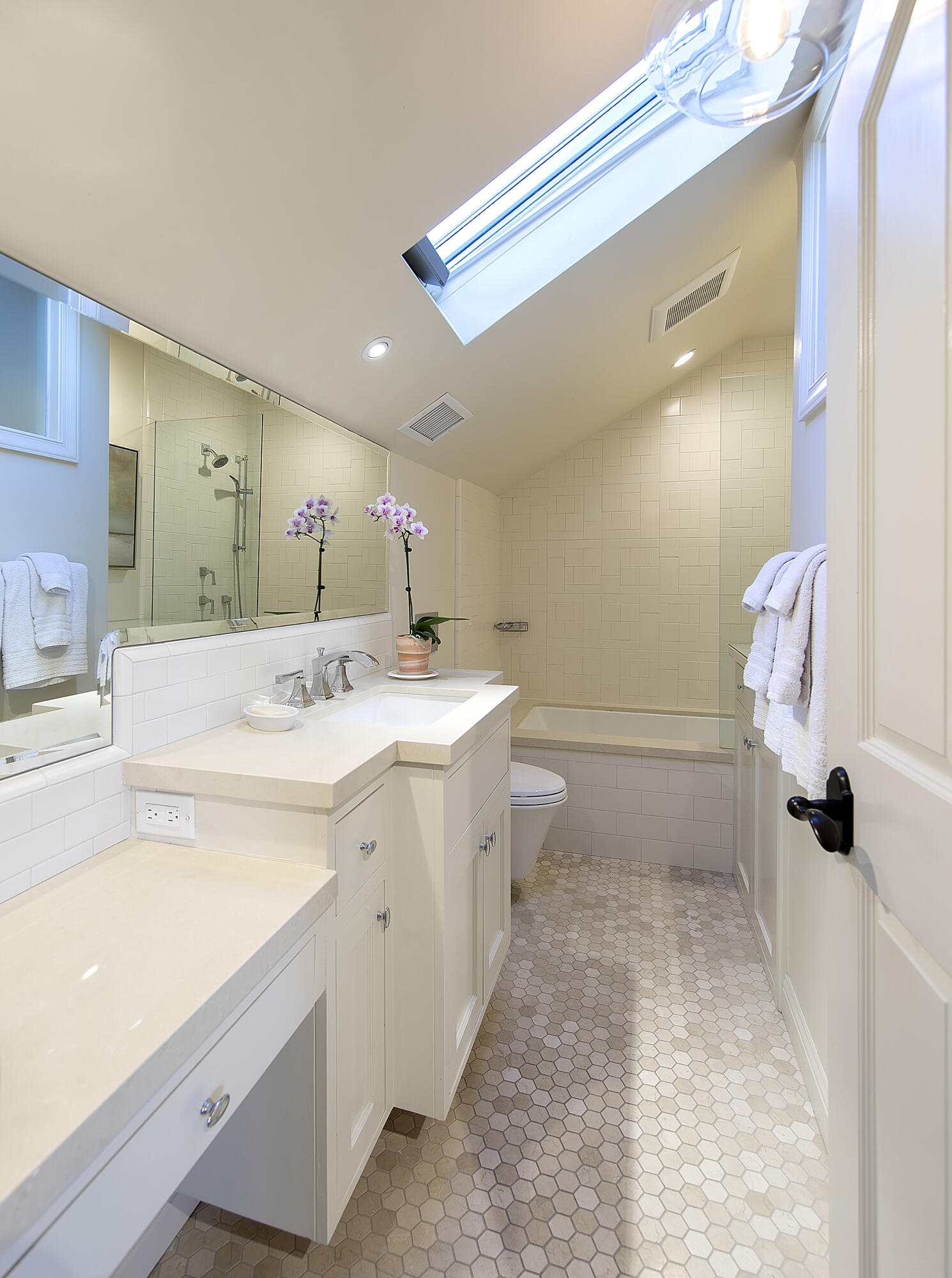 544 San Ysidro Road, Unit B Montecito, CA 93108 - Photo 15 of 18 a bathroom with a double vanity sink a toilet and a mirror