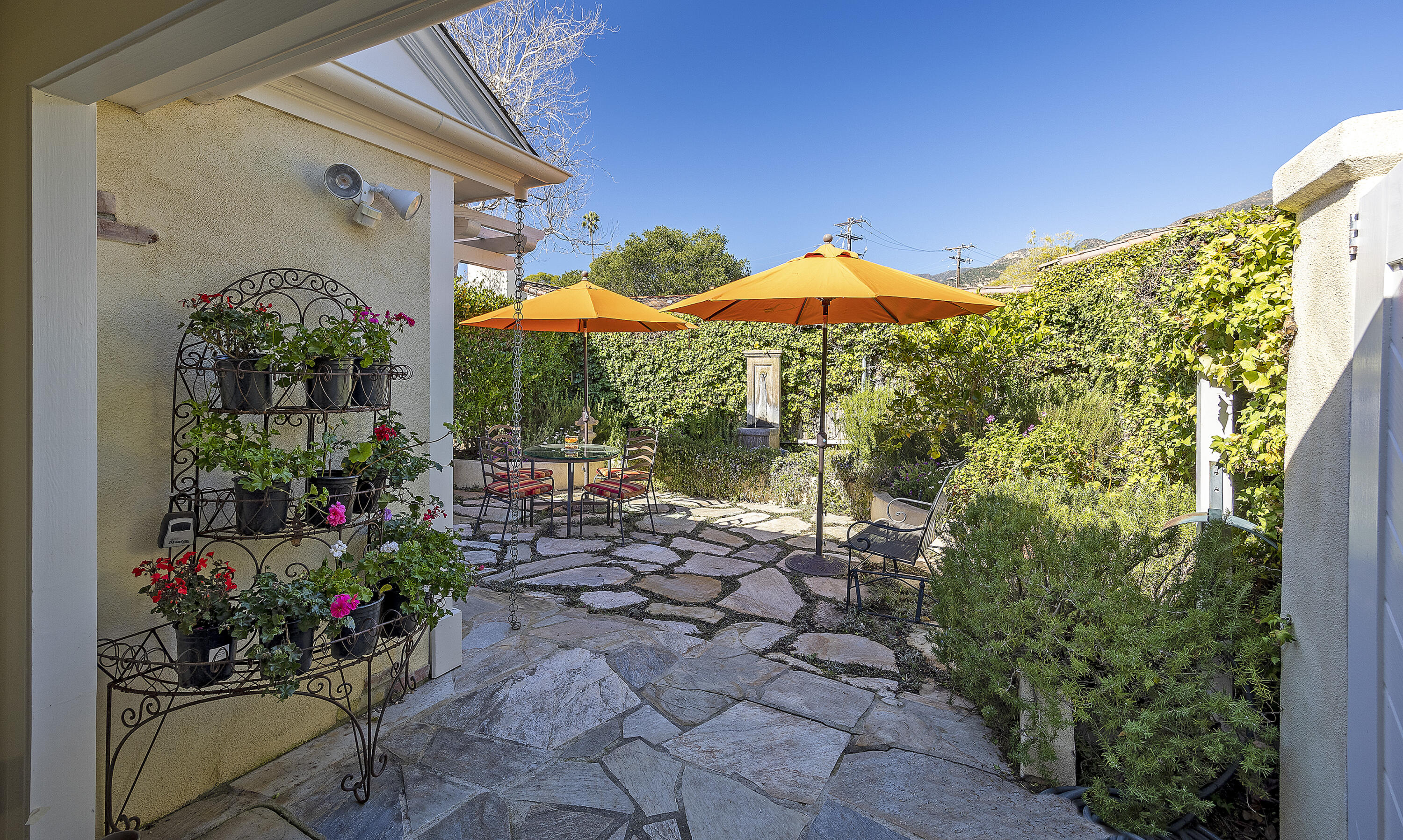 544 San Ysidro Road, Unit B Montecito, CA 93108 - Photo 3 of 18 a view of a potted plants in front of a house