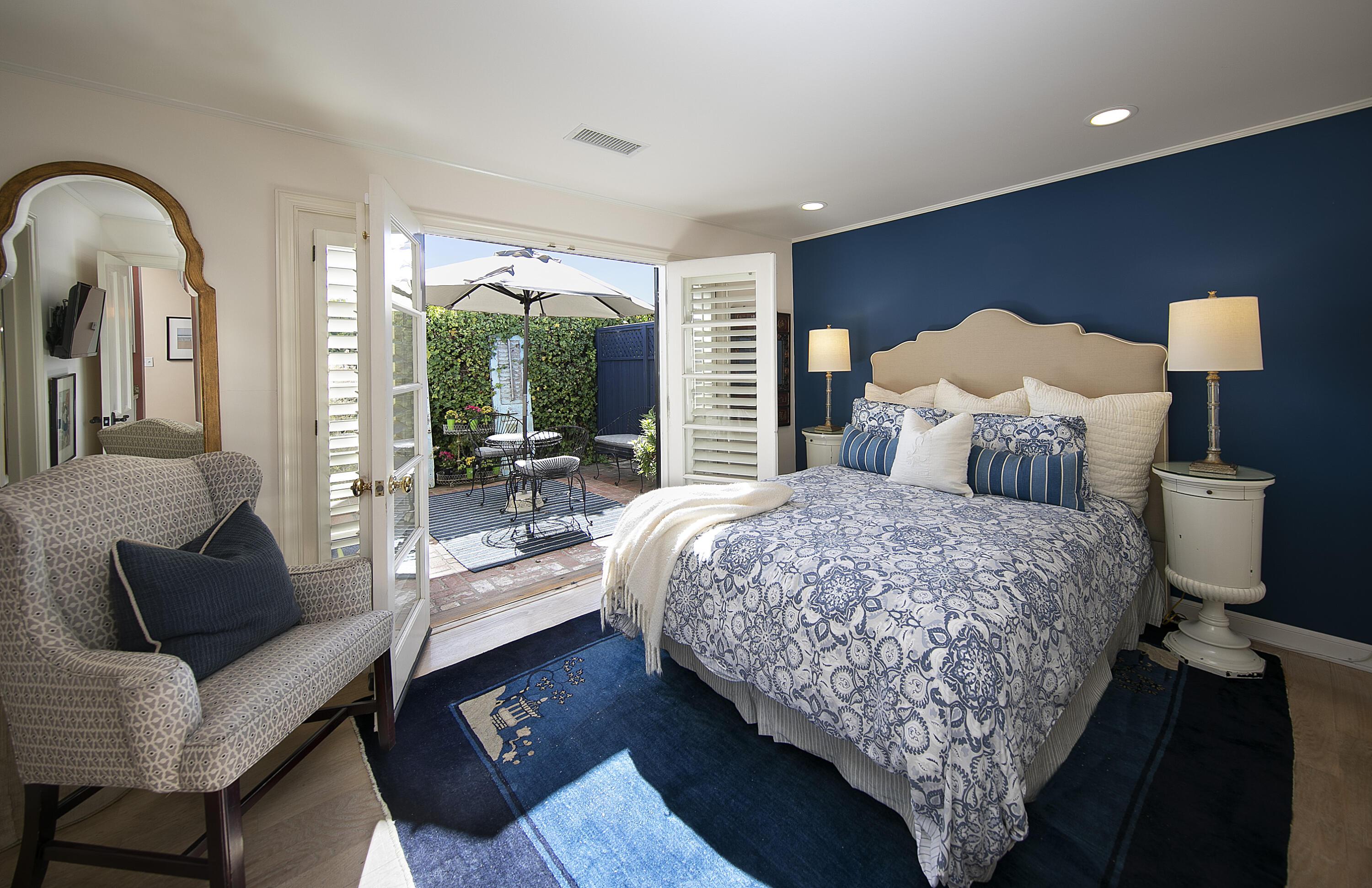 544 San Ysidro Road, Unit B Montecito, CA 93108 - Photo 10 of 18 a bedroom with a bed and wooden floor