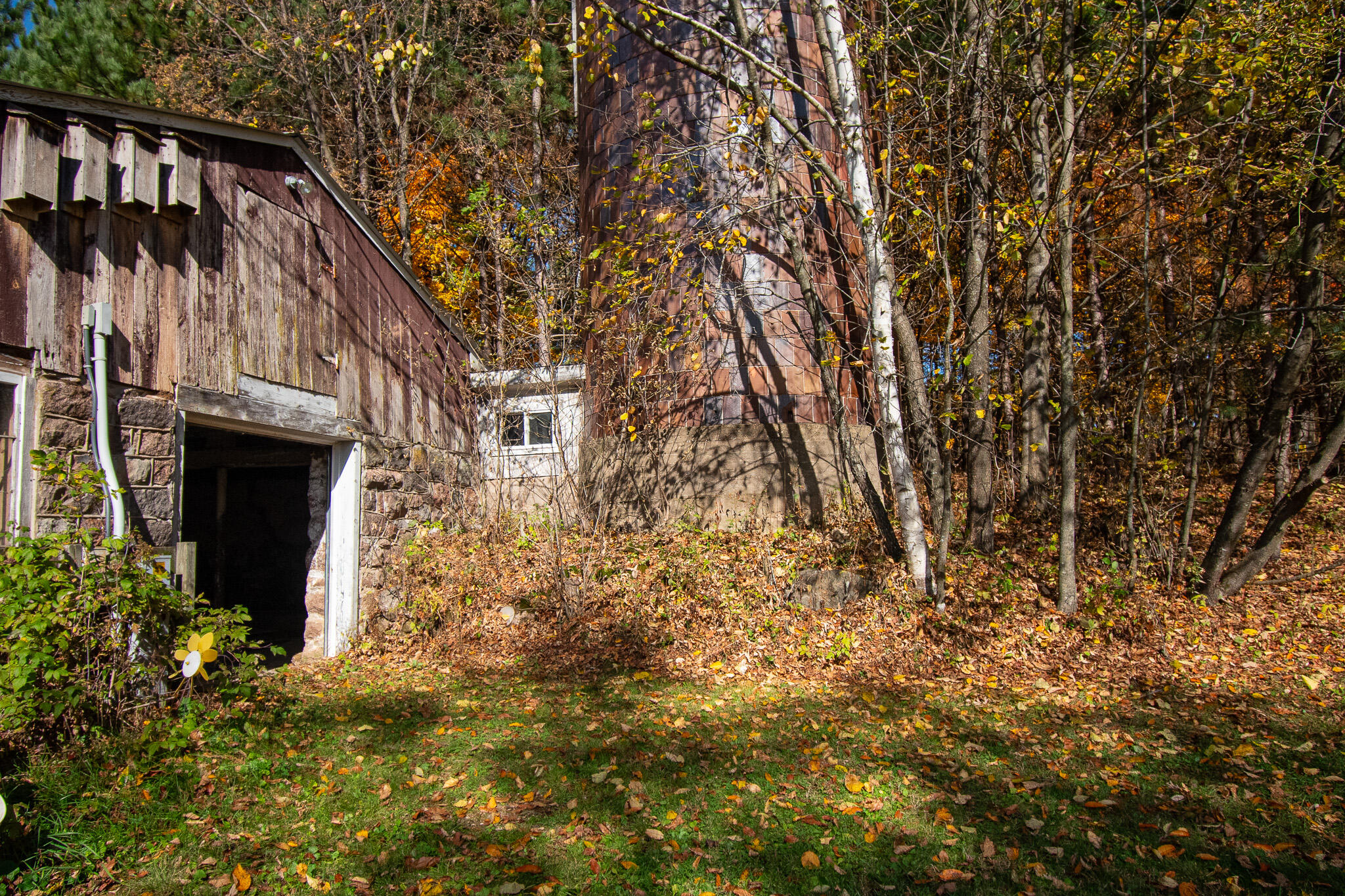 E516 Rustad Road Harrison, WI 54945 - Photo 37 of 52 w/ brown tiled silo