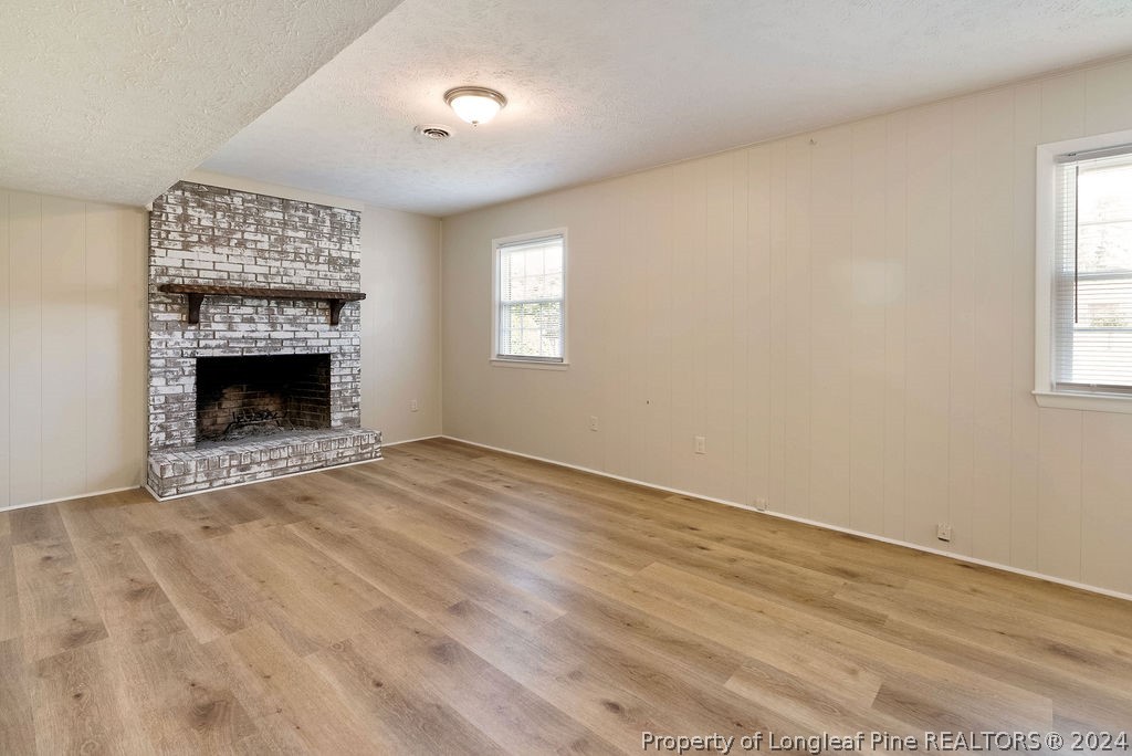 6623 Grist Mill Road Fayetteville, NC 28314 - Photo 12 of 15 a view of an empty room with a window and fireplace