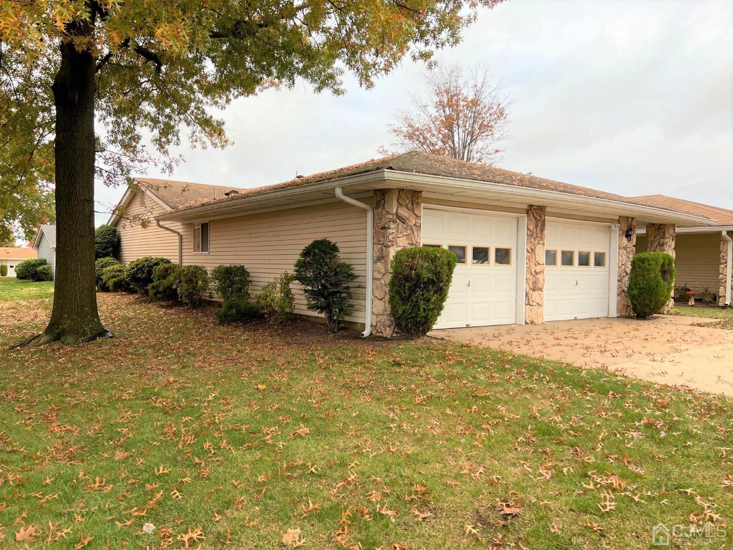 783B Risley Road, Unit A Monroe Township, NJ 08831 - Photo 2 of 30 a view of a house with a yard and garage