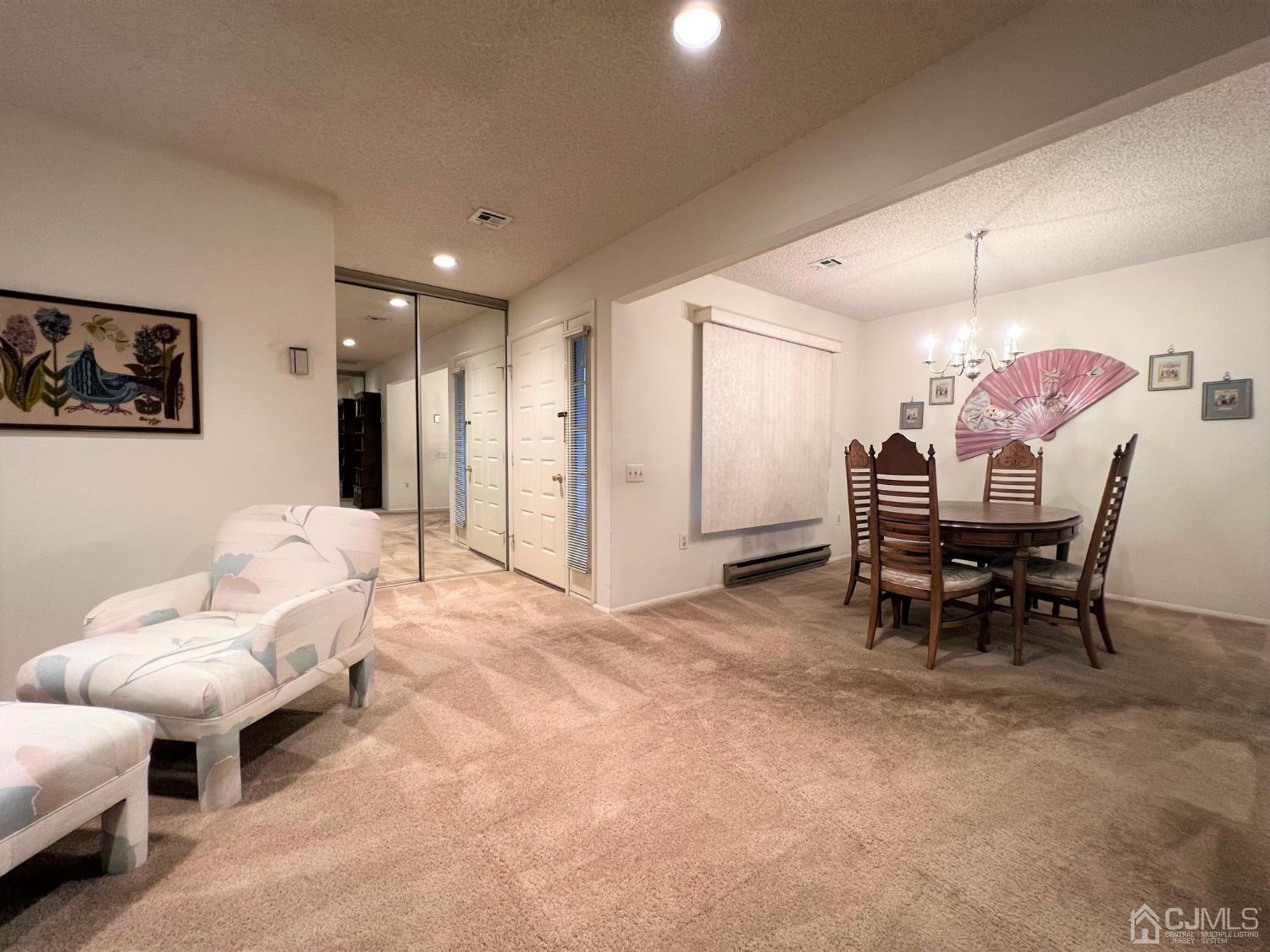 783B Risley Road, Unit A Monroe Township, NJ 08831 - Photo 7 of 30 a living room with furniture and a dining table