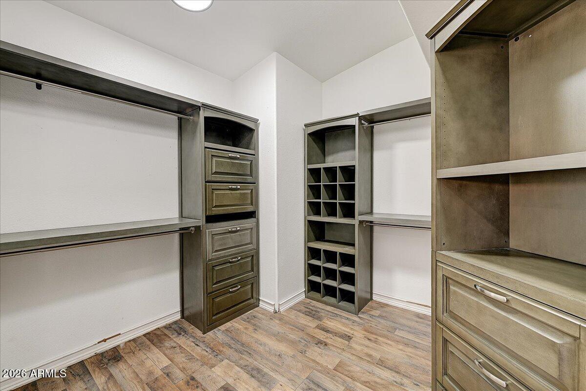 7624 North Citrus Road Waddell, AZ 85355 - Photo 27 of 57 a view of walk in closet with empty racks