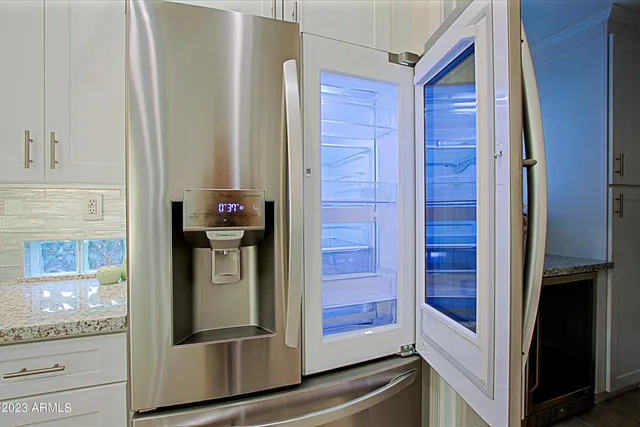 a bedroom with a bed dresser and a window