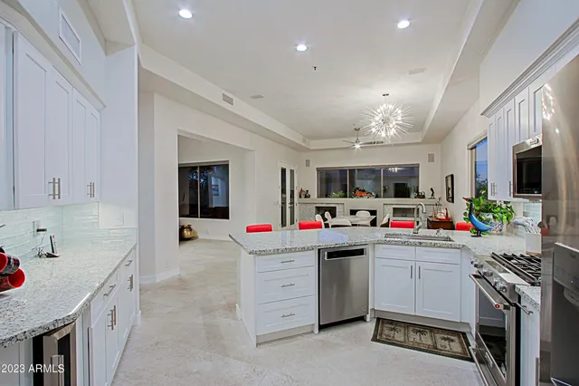 a bathroom with a granite countertop tub sink and shower