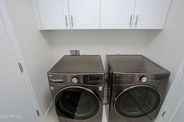 a bedroom with a bed and a ceiling fan