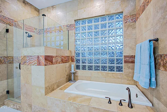 a view of backyard with outdoor seating and plants