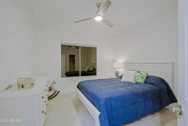 a living room with lots of furniture and a wooden floor