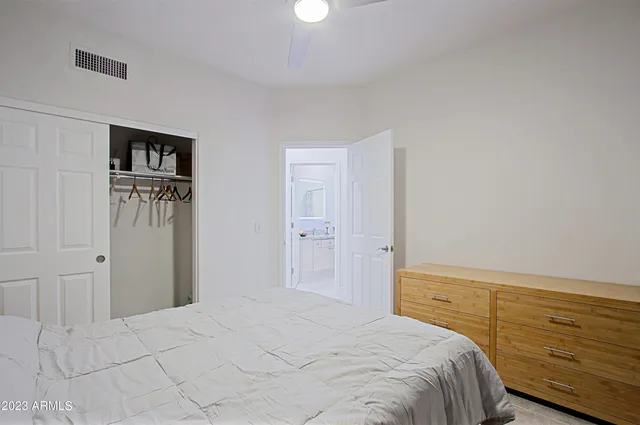 a living room with lots of furniture and a large window