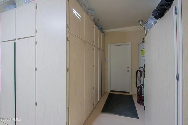 a view of a lake with boats and trees in the background