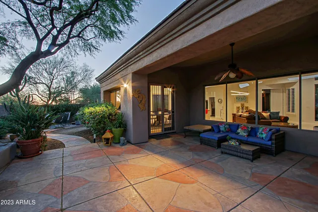 a view of a swimming pool with a patio