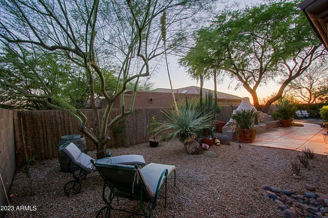 a view of swimming pool with outdoor seating and city view