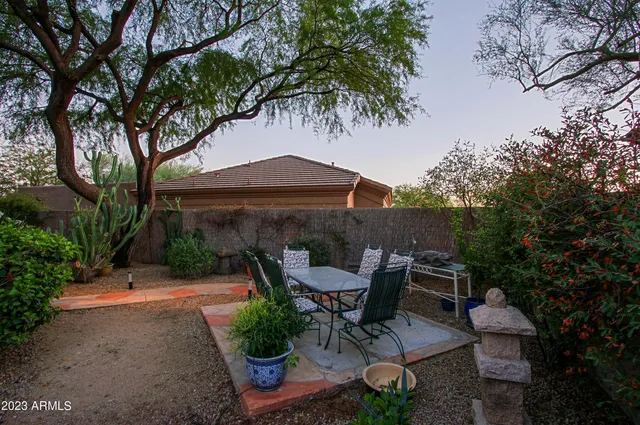 a room with furniture a large window and a sink