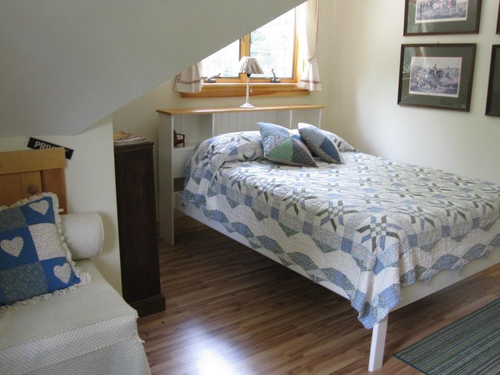 233 Gus Moore Road Penobscot, ME 04476 - Photo 30 of 35 The bedroom in the garage apartment.
