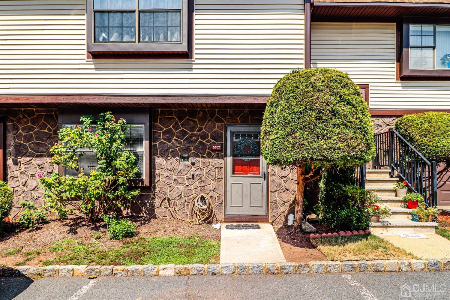 5702 Hana Road Edison, NJ 08817 - Photo 1 of 30 a front view of a house with garden