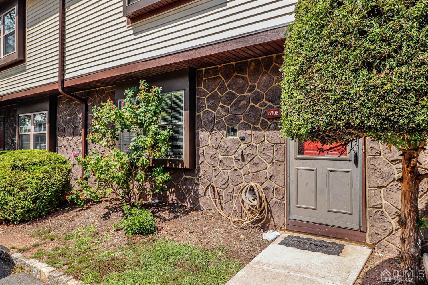 5702 Hana Road Edison, NJ 08817 - Photo 3 of 30 a front view of a house with a garden