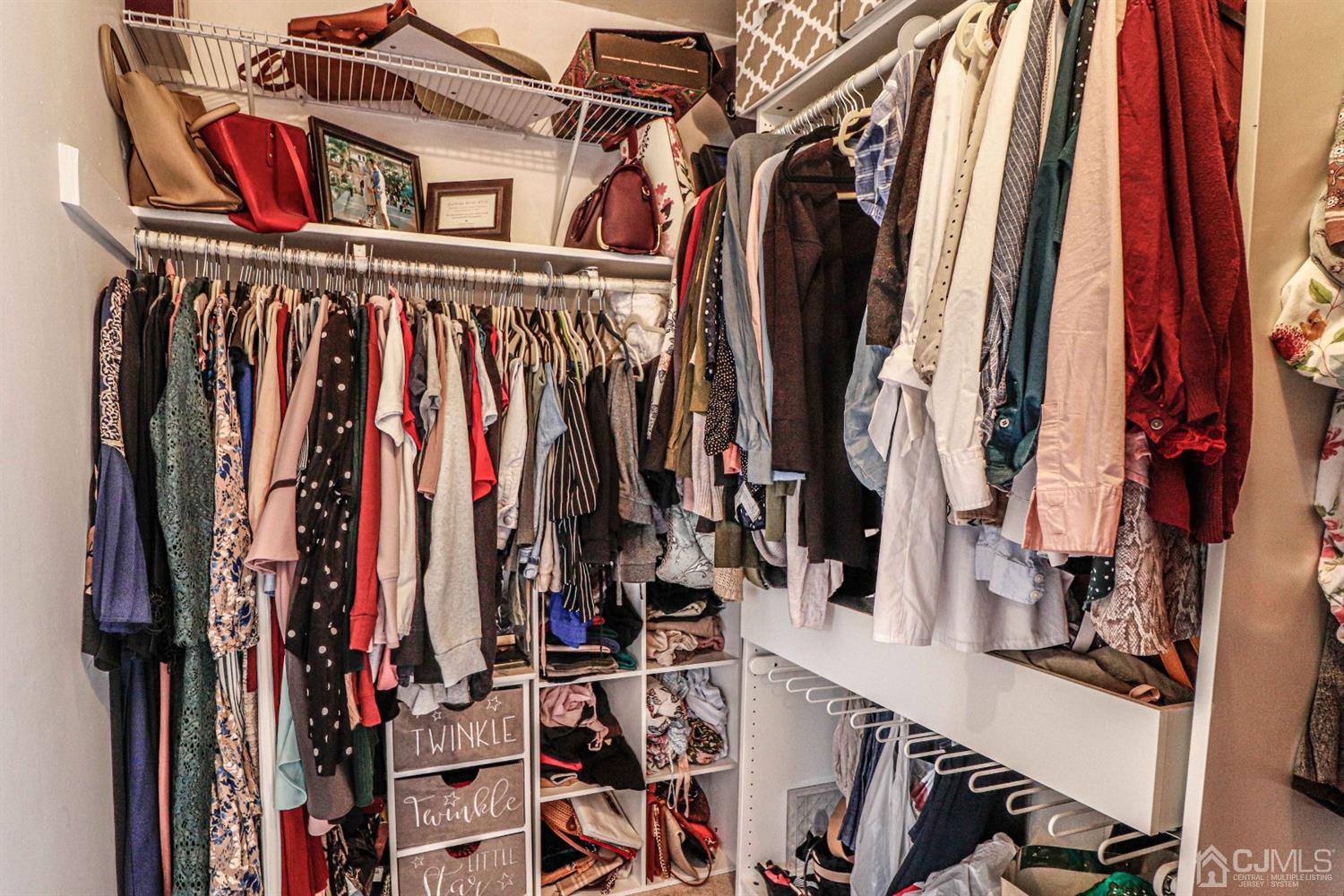 5702 Hana Road Edison, NJ 08817 - Photo 25 of 30 a view of walk in closet with clothes