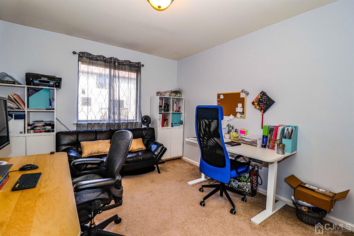 5702 Hana Road Edison, NJ 08817 - Photo 27 of 30 a room with furniture and a window