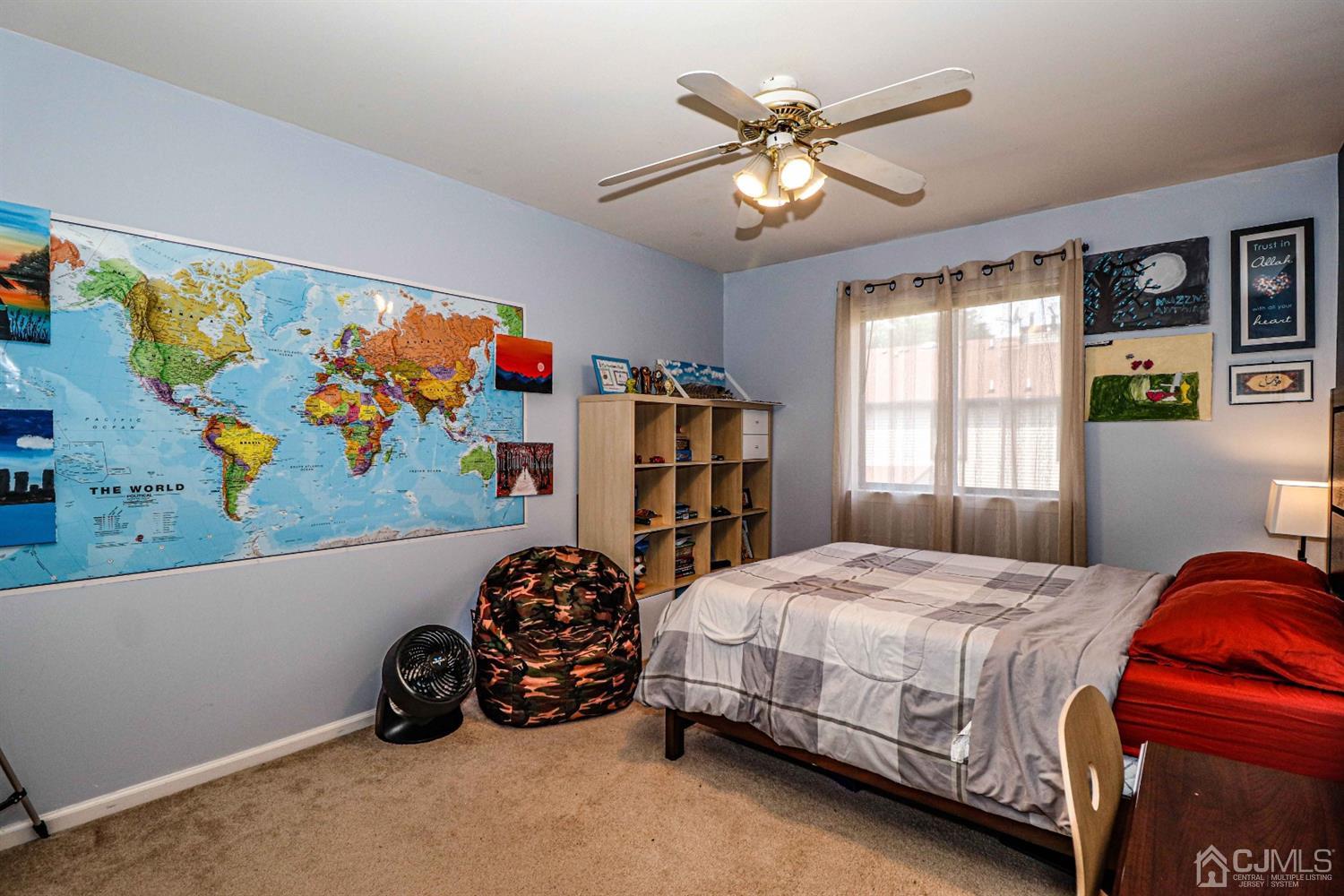 5702 Hana Road Edison, NJ 08817 - Photo 28 of 30 a bedroom with a bed and a window