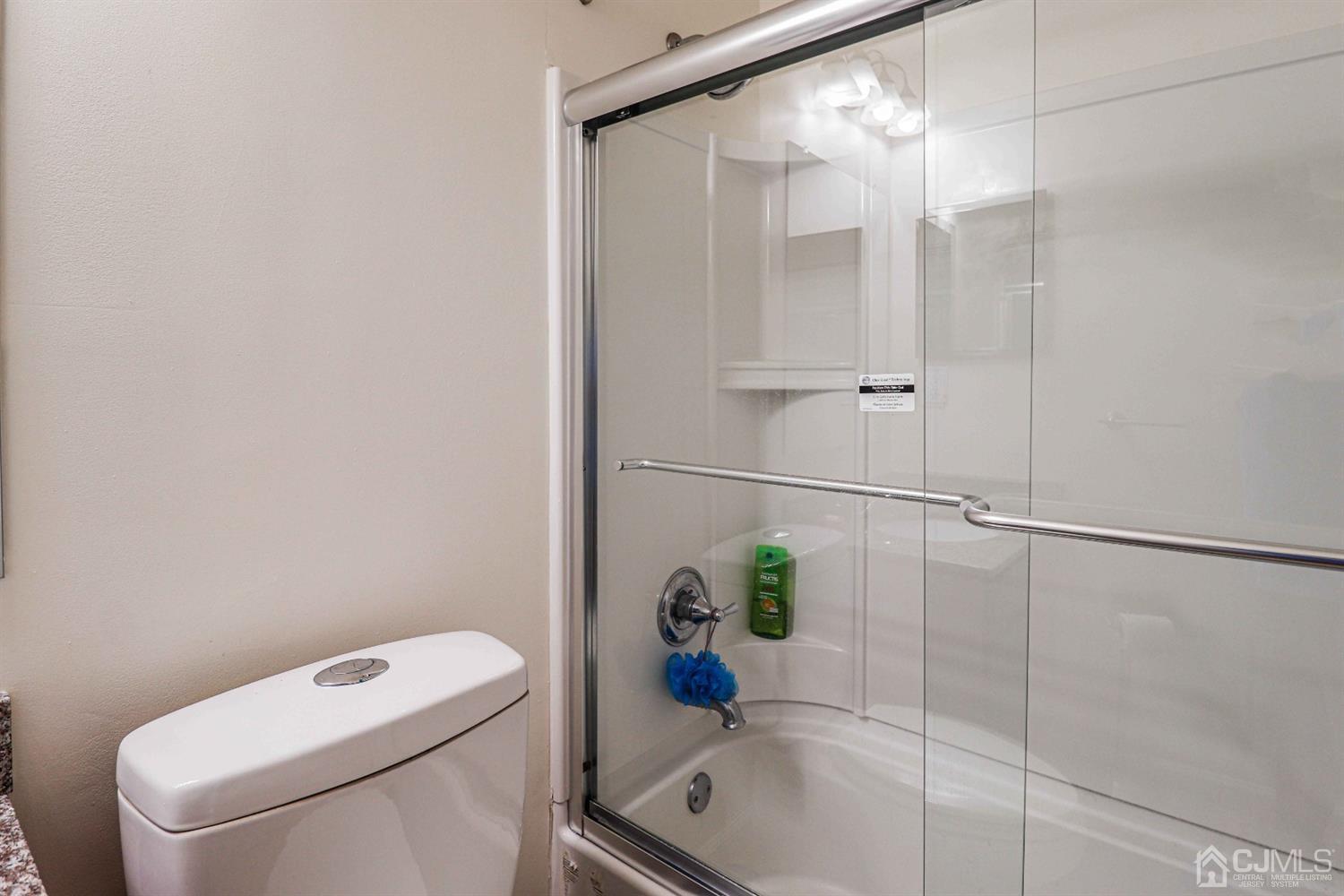 5702 Hana Road Edison, NJ 08817 - Photo 30 of 30 a bathroom with a shower and toilet