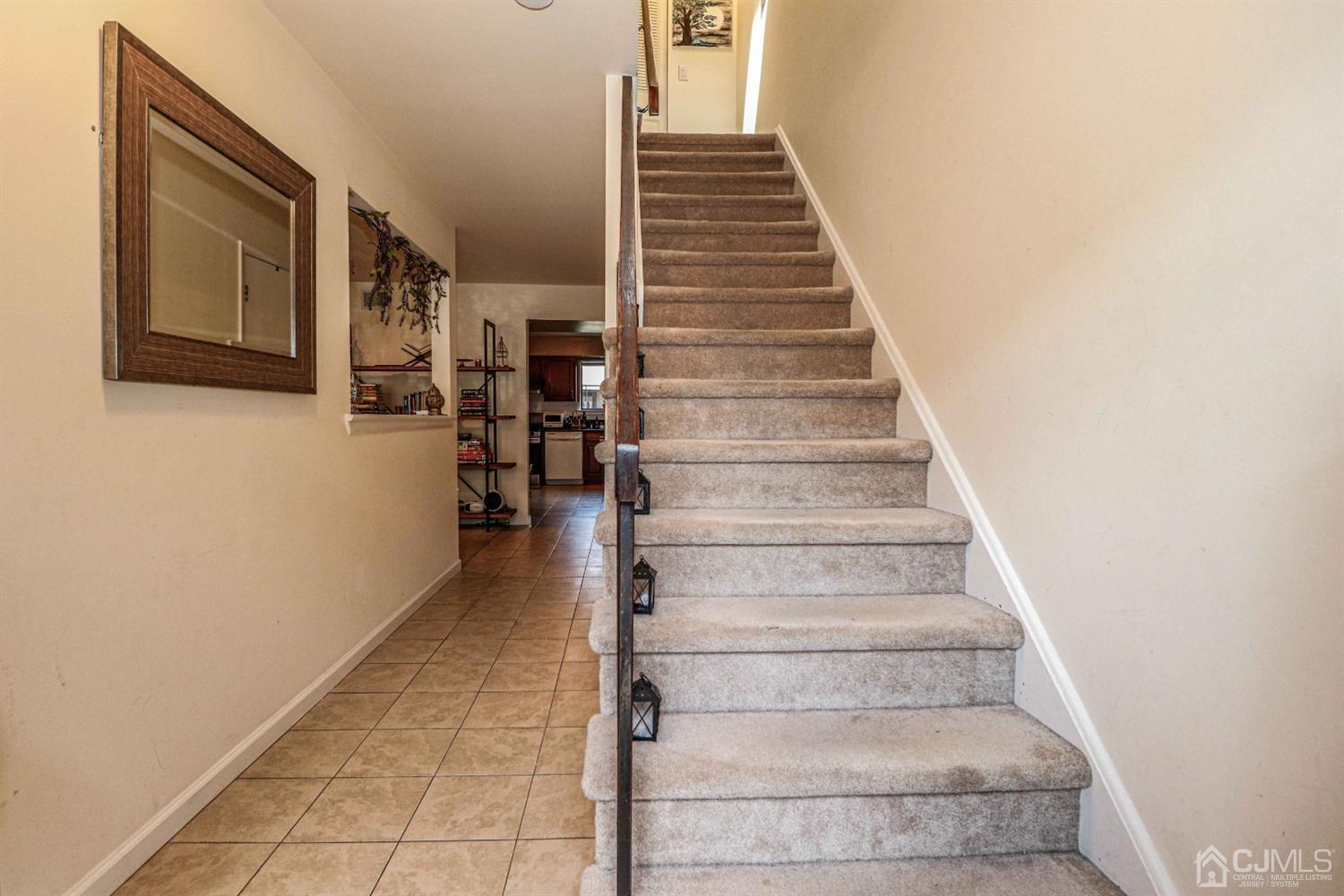 5702 Hana Road Edison, NJ 08817 - Photo 5 of 30 a view of staircase with white walls
