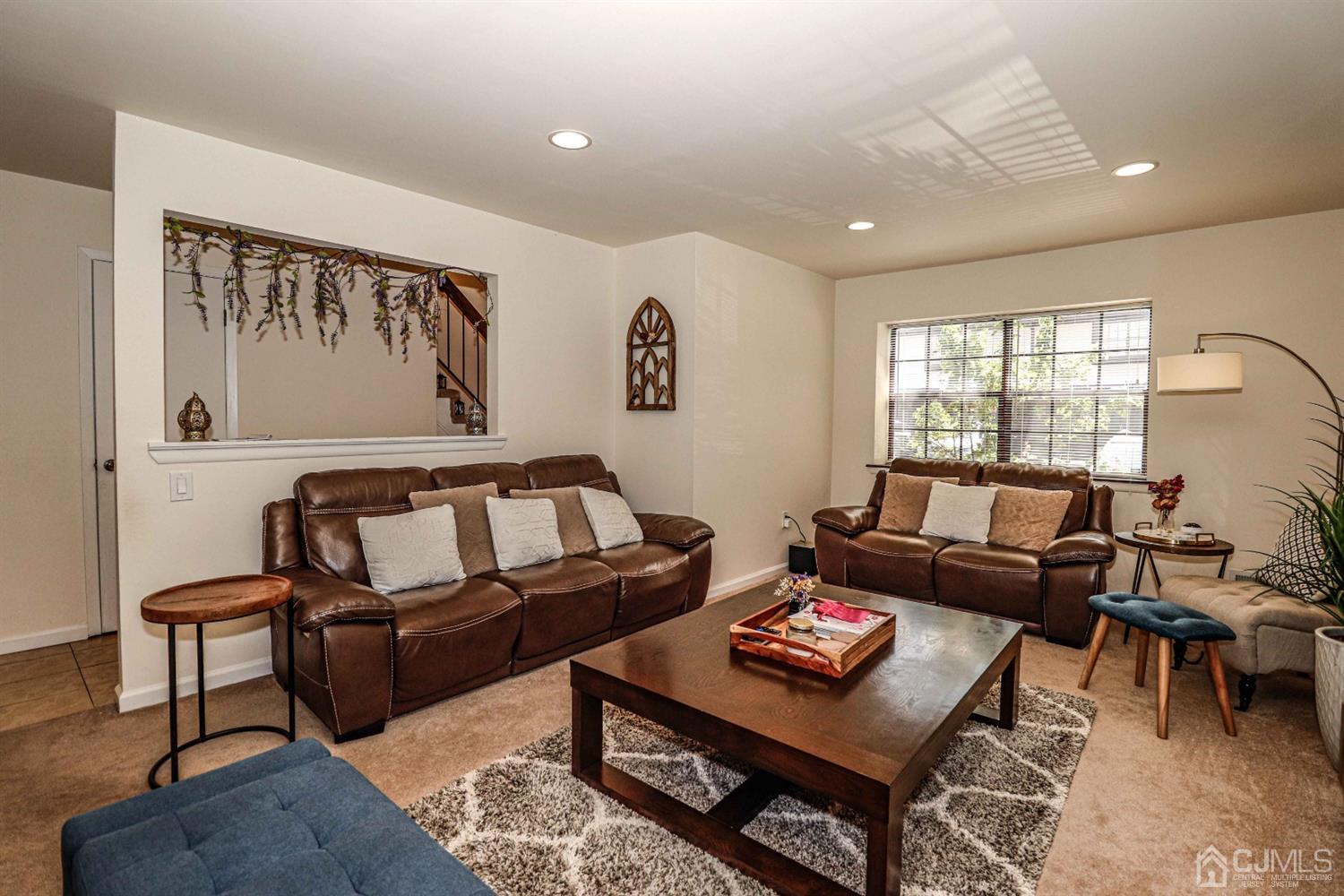 5702 Hana Road Edison, NJ 08817 - Photo 9 of 30 a living room with furniture and a window