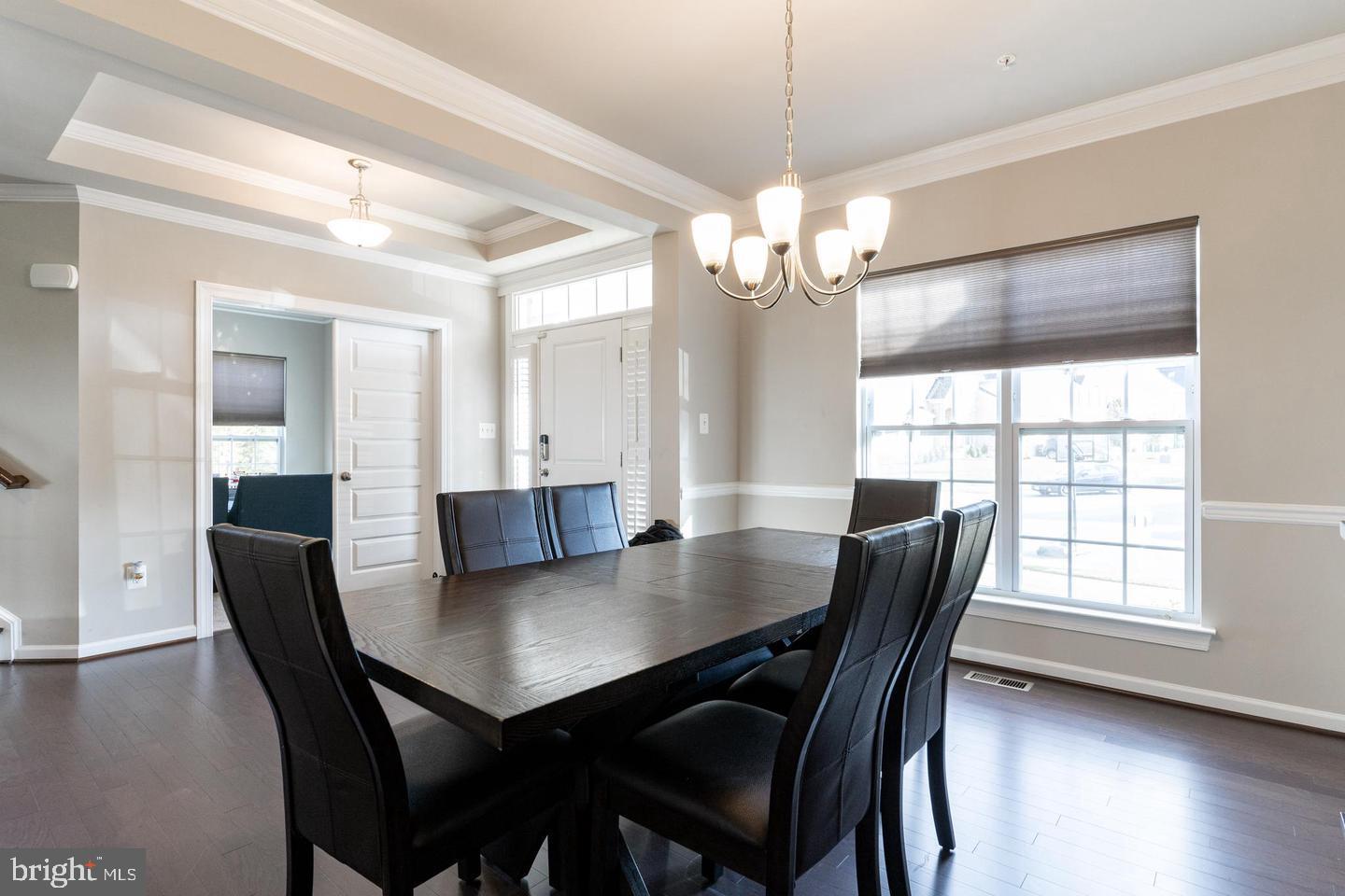 6100 Oglethorpe Mill Drive Brandywine, MD 20613 - Photo 8 of 22 a view of a dining room with furniture window and wooden floor