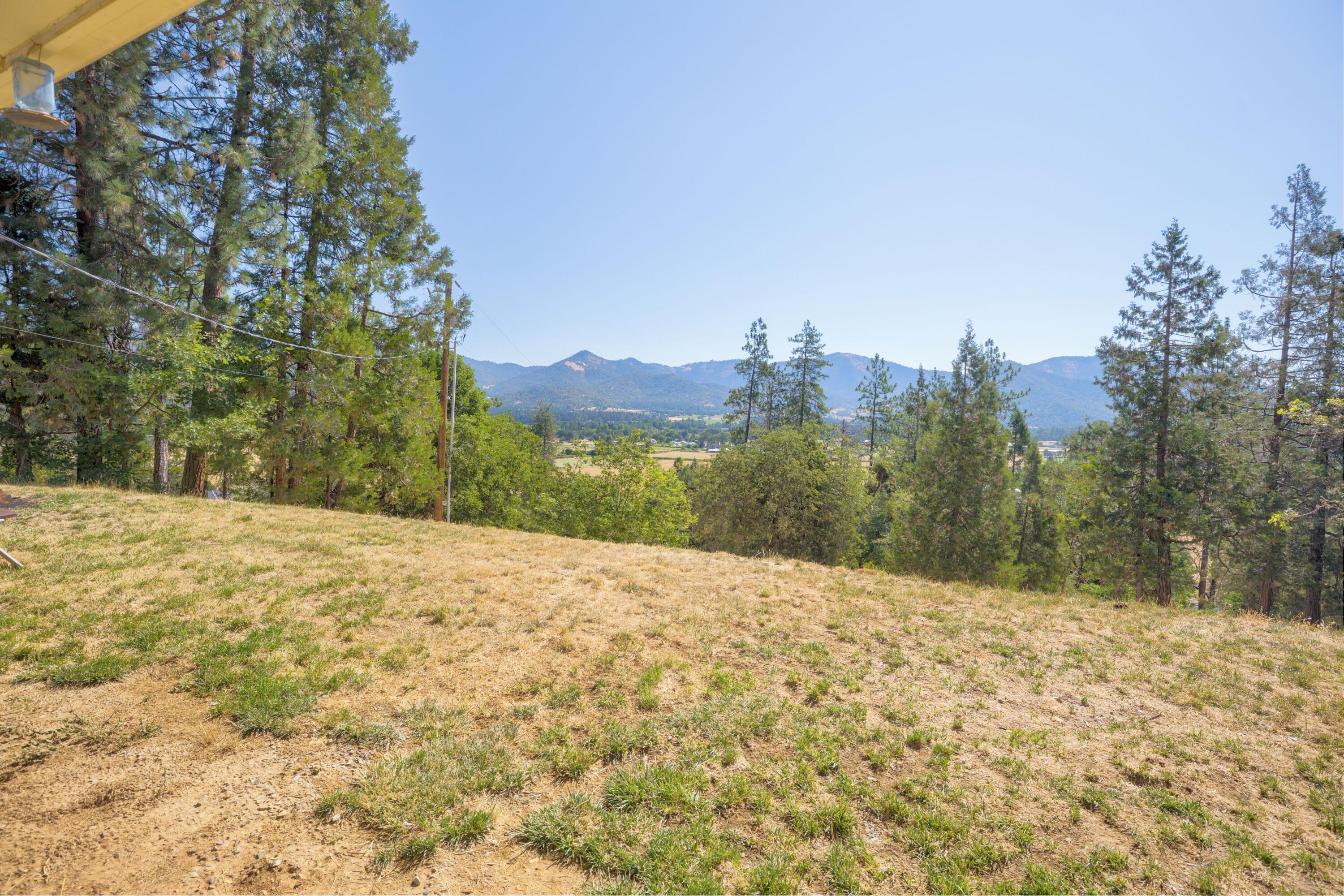 12748 Water Gap Road Williams, OR 97544 - Photo 29 of 35 a view of a yard with a house