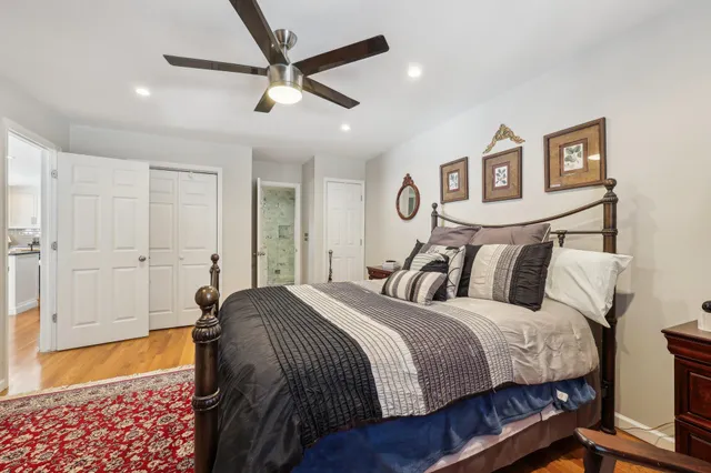 a bed room with a bed and a chandelier