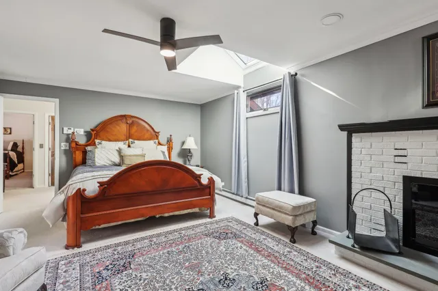 a living room with furniture a rug and a fireplace