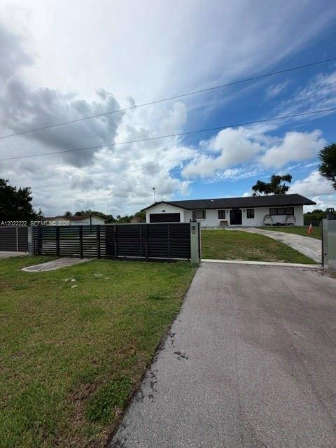 20465 Southwest 200th Street Miami, FL 33187 - Photo 1 of 36 a view of a big yard next to a yard