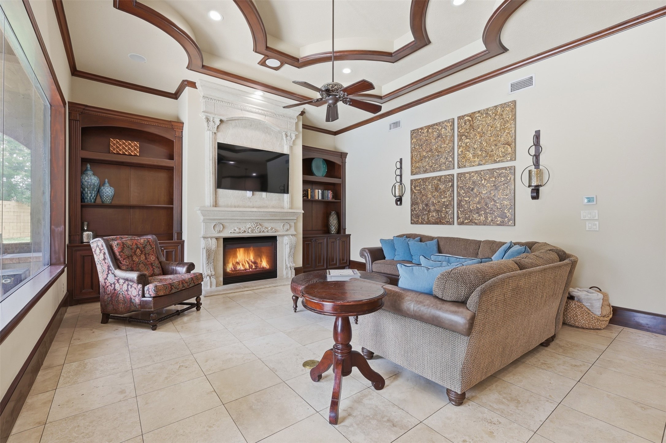 14 Post Shadow Estate Drive Spring, TX 77389 - Photo 18 of 49 a living room with furniture a flat screen tv and a fireplace