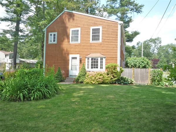 10 Sunset Road Norton, MA 02766 - Photo 1 of 23 a view of a house with a yard and plants