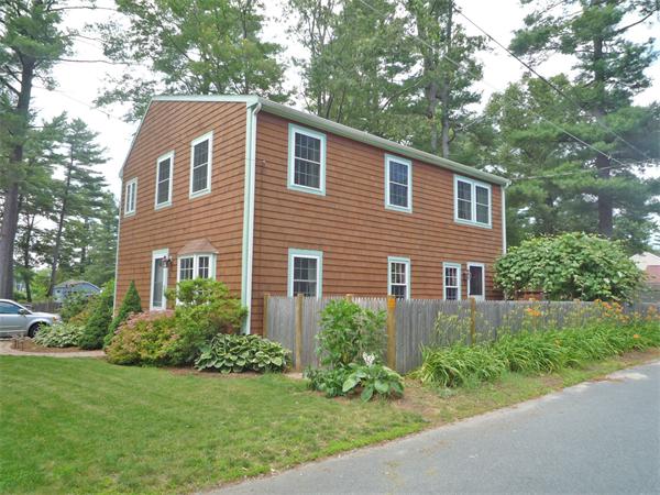 10 Sunset Road Norton, MA 02766 - Photo 2 of 23 a front view of a house with a yard