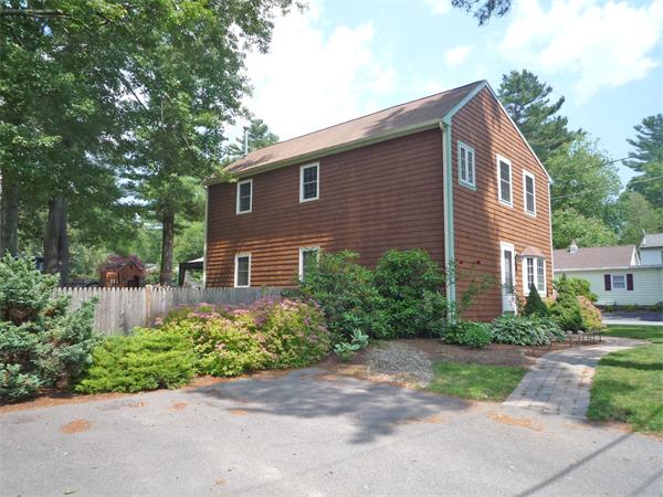 10 Sunset Road Norton, MA 02766 - Photo 3 of 23 a front view of a house with a yard and trees