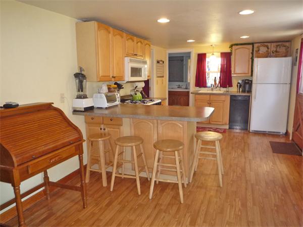 10 Sunset Road Norton, MA 02766 - Photo 4 of 23 a view of a dining room with furniture and wooden floor