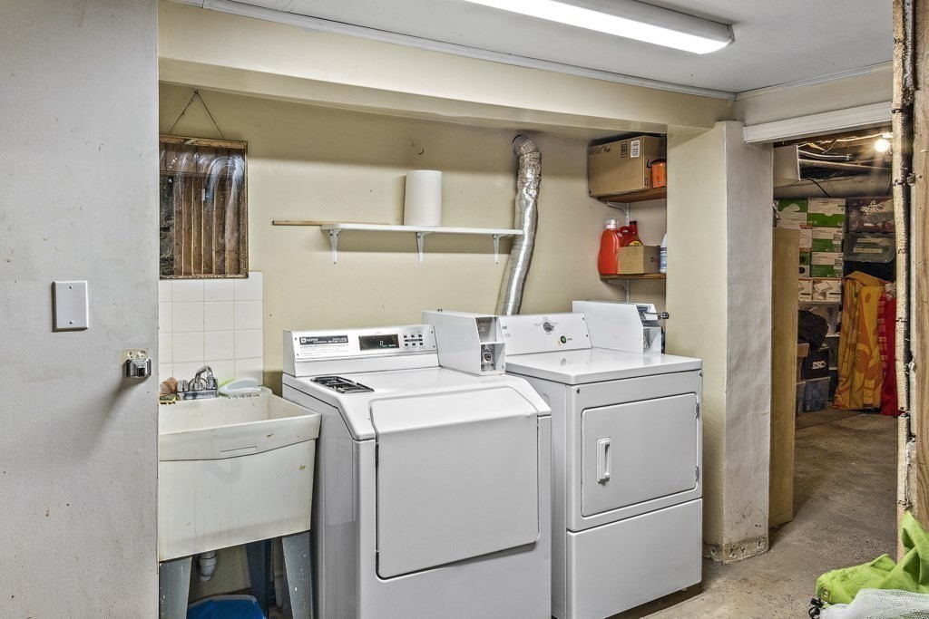 105 Walnut Street, Unit 1 Somerville, MA 02145 - Photo 10 of 14 a storage room with a washer and dryer