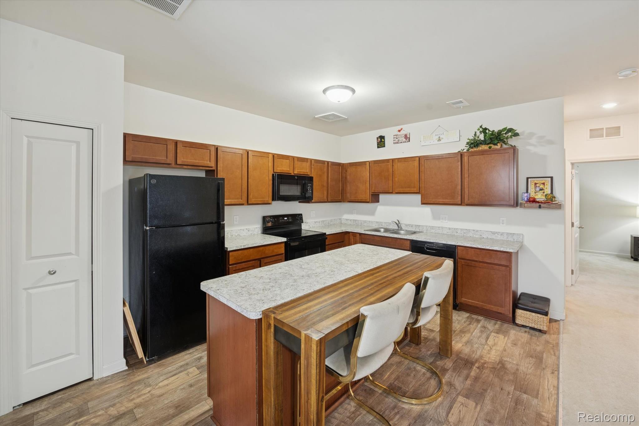 10028 Ridge Run Street, Unit 10 Howell, MI 48855 - Photo 8 of 21 Kitchen island great for cooking prep and additional seating.