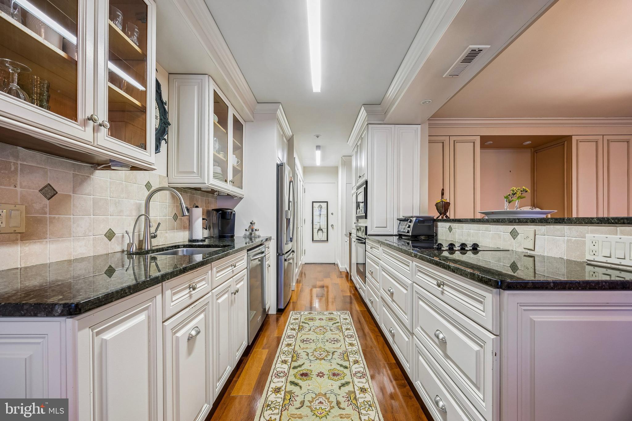 41 Conshohocken State Road, Unit 603 Bala Cynwyd, PA 19004 - Photo 10 of 37 a large kitchen with stainless steel appliances a sink and cabinets