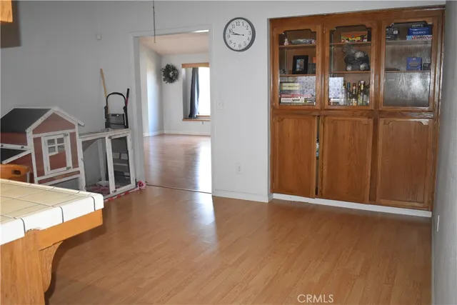 an entryway with wooden floor