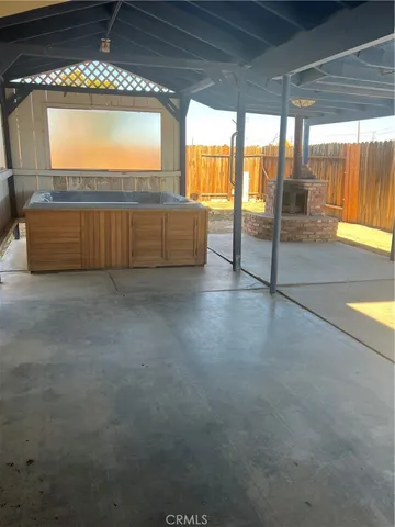 a view of an empty room with a fireplace