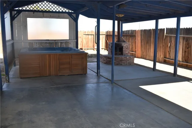 a view of a floor to ceiling window and wooden floor