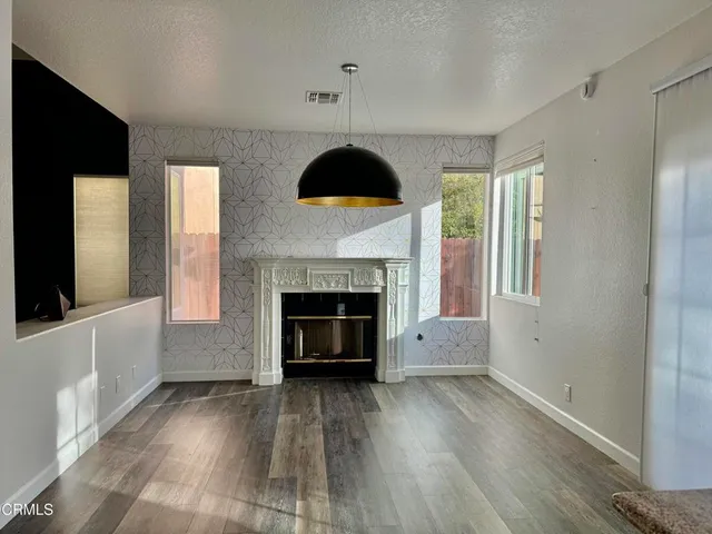 a bathroom with a granite countertop sink mirror and vanity