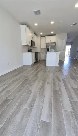 a front view of a building with a yard and garage