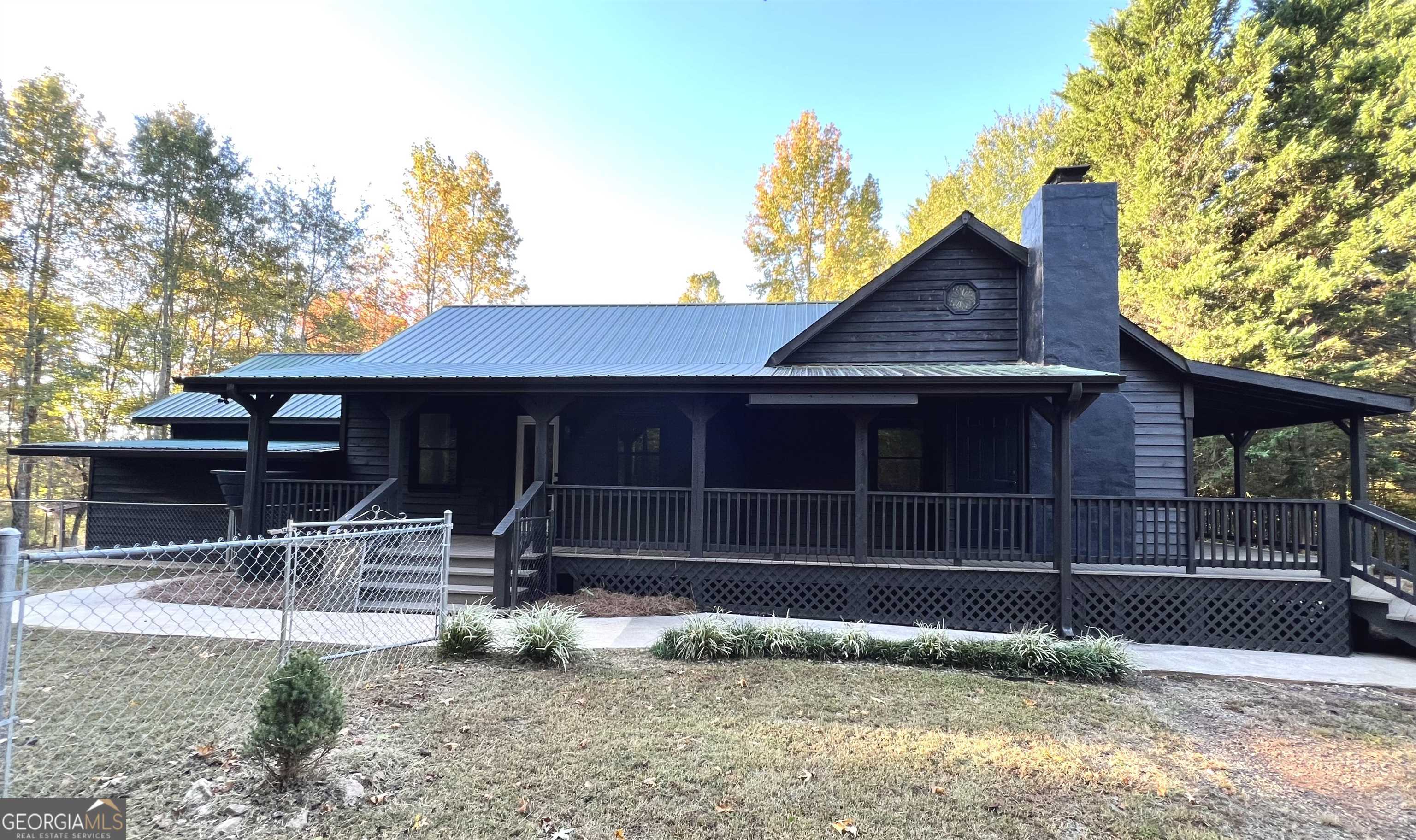 1498 Dooley Road Clarkesville, GA 30523 - Photo 1 of 1 a backyard of a house with barbeque oven