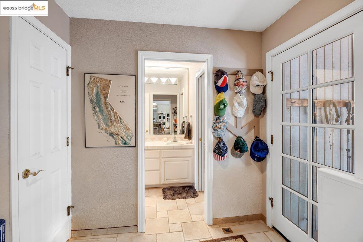 13700 Clements Road Groveland, CA 95321 - Photo 35 of 93 Entryway featuring a textured wall and baseboards