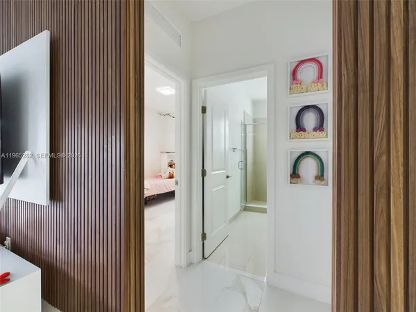 a front view of a house with entryway bathroom and wooden floor